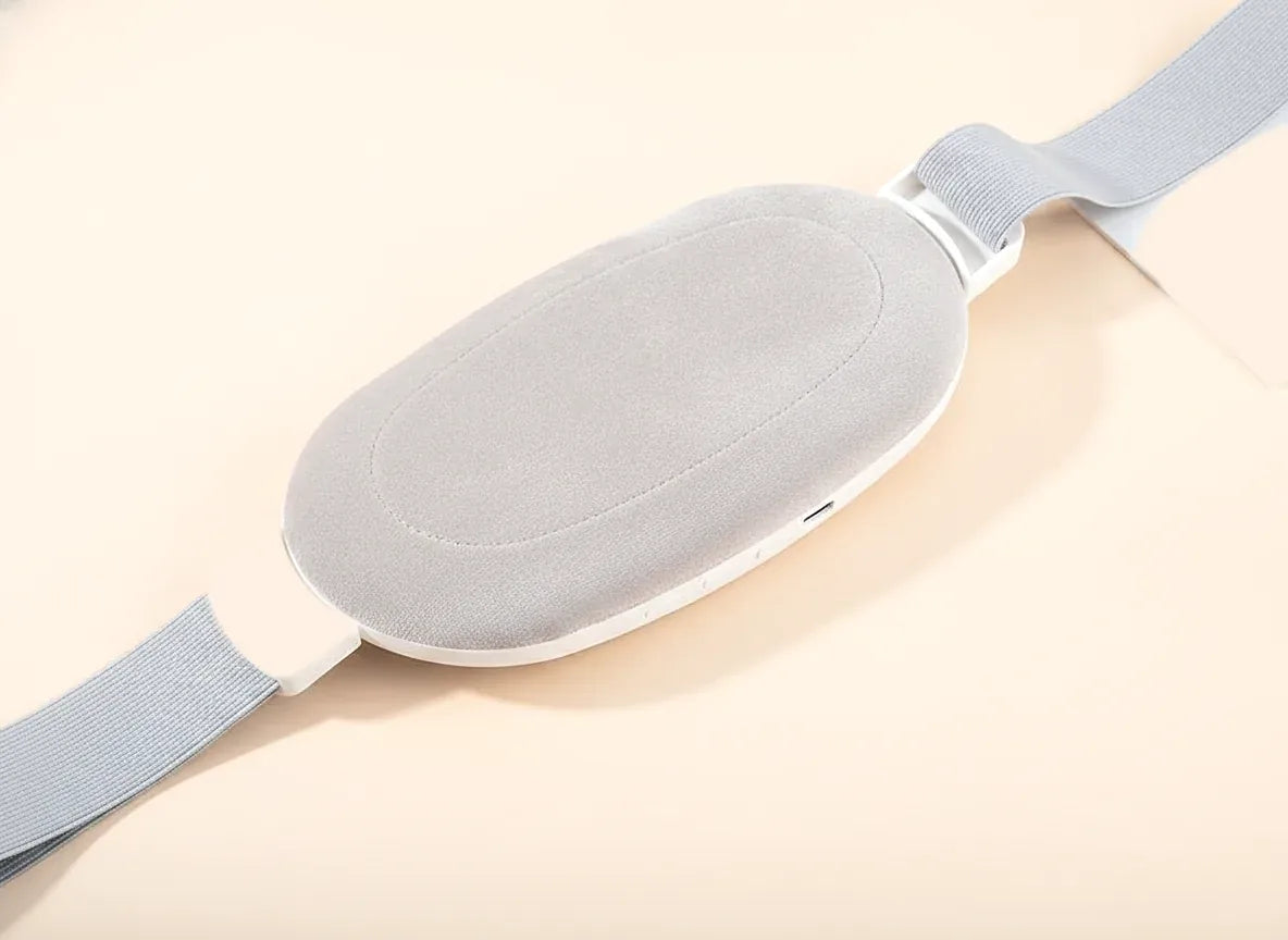 The back of the pad: a soft grey cushion inside a white rim, with the strap threaded through both ends.