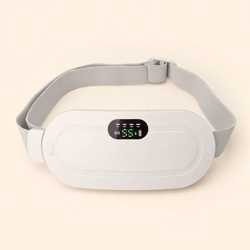 The BringWarm Pad in white: a cordless heated pad with a green display, three buttons and a USB-C port along one edge, and a soft grey adjustable strap.